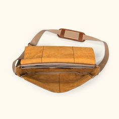 rustic leather messenger bag for laptops and commuters Retro Rectangular Leather Travel Backpack, Retro Rectangular Leather Backpack For Travel, Luxury Flap Bag For Travel, Luxury Travel Flap Bag, Brown Coated Canvas Flap Shoulder Bag, Brown Flap Shoulder Bag In Coated Canvas, Brown Rectangular Coated Canvas Flap Bag, Rectangular Brown Coated Canvas Flap Bag, Luxury Flap Shoulder Bag For Travel