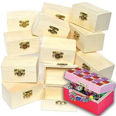 many white boxes are stacked on top of each other with gold handles and knobs