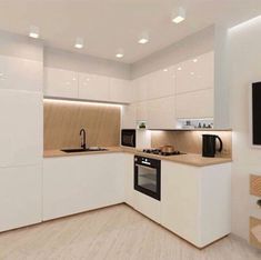 a kitchen with white cabinets and wood flooring is shown in this image, there is a television on the wall next to the stove