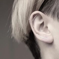 Handmade polished sterling silver ear cuff. A crescent line on the front, and a circle on the back to hold the cuff securely in place.Dimensions: 23x15mmWidth: 1mmSold: Individually or as a pair* Suitable for non-pierced ears.Also available in a longer version:https://www.etsy.com/listing/234077755/circle-long-line-sterling-silver-earVisit my shop: http://www.etsy.com/shop/jewelrymirta© MIRTA Minimalist Ear Cuff, Silver Bracelet Stack, Silver Necklace Designs, Circle Line, Fake Gauge Earrings, Oxidized Silver Earrings, Barbell Earrings, Diamond Ear Cuff, Ear Climbers Earrings