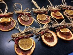 orange slices are tied with twine and placed on top of each other for decoration