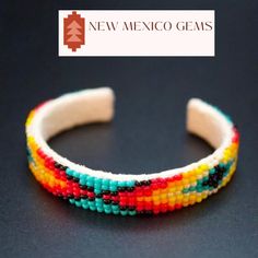 This is an adjustable/bendable/flexible to wrist bracelet. It is a Navajo beaded bracelet on soft white deerskin. Beaded cuff bendable bracelet. Southwestern, western jewelry. Navajo, tribal, pueblo jewelry. New Mexico handcrafted, Native American beadwork. Geometric, abstract beadwork. Desert style minimalist jewelry.  *approx. 1/2" wide X 6 1/8" length  *adjustable  *unisex Native American patterns and designs have symbolic meanings. The patterns are often repeated, representing the repetitive nature of our lives. The different designs are made up of one or more symbols to suggest hope and intent, to communicate with the Great Spirit and to identify certain roles and responsibilities or to record stories. Though some patterns and designs vary from one tribe to another, several designs an Desert Jewelry, Geometric Beadwork, Symbolic Meanings, Desert Style, Native American Patterns, Desert Fashion, Huichol Art, Wrist Bracelet, Bracelet Minimalist