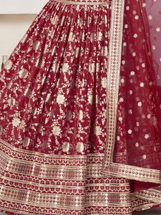 Introducing our stunning "glamorous red zari embroidered jacquard wedding lehenga choli" that is sure to make you stand out at any wedding or special occasion. This exquisite ensemble features a red color jacquard lehenga with intricate zari embroidered work and sequin work, paired with a matching jacquard choli and net dupatta. The lehenga is semi-stitched up to 42 inches, allowing for a perfect fit, while the choli comes as unstitched material for customization. The net dupatta with four side Festive Red Anarkali Set With Zari Work, Red Floor-length Dola Silk Anarkali Set, Red Floor-length Art Silk Anarkali Set, Red Semi-stitched Anarkali Set With Pallu, Red Georgette Lehenga For Navratri, Floor-length Brocade Lehenga With Intricate Embroidery, Red Unstitched Floor-length Traditional Wear, Red Floor-length Anarkali Set With Intricate Embroidery, Red Anarkali Choli In Georgette