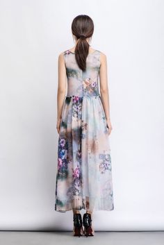 This floral chiffon dress is a timeless beauty and both graceful and elegant. In a watercolor flowers print, the summer party dress is as pretty as a picture. Weather you wear it to a summer barbeque or wedding party, you know that all eyes will be on you. The gorgeous silhouette of this dress will allow your style to shine through. Clean details and a simple cut allow the beautiful fabric to speak for itself. This dress will make you look like you've stepped out of a Monet painting! FEATURES - Summer Sleeveless Chiffon Dress For Garden Party, Sleeveless Summer Chiffon Dress For Garden Party, Multicolor Flowy Sleeveless Chiffon Dress, Multicolor Floral Print Sleeveless Chiffon Dress, Sleeveless Multicolor Floral Chiffon Dress, Multicolor Sleeveless Chiffon Dress With Floral Print, Bohemian Sleeveless Chiffon Dress For Garden Party, Multicolor Chiffon Maxi Dress For Garden Party, Elegant Multicolor Floral Dress For Summer