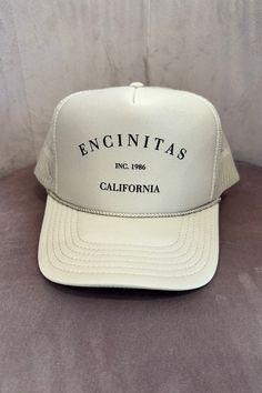 COLOR: Sand The Encinitas Trucker hat is the perfect way to show pride in your favorite city! Featuring a classic Encinitas, CA printing, mesh back, foam cap and adjustable snapback. DETAILS + CARE: 100% Polyester One size fits most Designed in Ventura, CA Jesus Wallpaper, Color Sand, Instagram Tags, Favorite City, Clothing Ideas, Color Khaki, Trucker Cap, Apparel Accessories, Trucker Hat