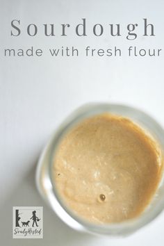 a bowl filled with liquid sitting on top of a table