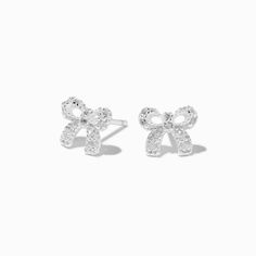 Finish your look with a bow in these stud earrings from our C LUXE by Claire's collection. The sterling silver bows are covered in sparkly cubic zirconias.About C LUXE by Claire'sCrafted with high-quality metals, gems, and materials to elevate your everyday look or showcase the perfect mix of fun with a dash of indulgence, C LUXE by Claire's is made for showing up to stand out.Finish: SilverClosure: HingeMaterial: Sterling silver - C LUXE by Claire's Sterling Silver Cubic Zirconia Bow Stud Earri Jewelry Accessories Silver, Claires Earrings, Cute Stud Earrings, Jewelry Words, Silver Jewelry Earrings, Fashionable Jewelry, 12th Birthday, Silver Bow, Jewelry Lookbook