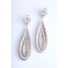 These earrings dance on the ear since both diamond tear drops dangle off the ear individually.  Set in 18kwg with 4 carats of diamonds, the earrings measure 2 1/4" tall by 5/8" wide.  Please see the measurements noted above in the description for best approximate dimensions Diamond Teardrop Chandelier Earrings, Diamond White Chandelier Earrings With Diamond Accents, Diamond White Teardrop Chandelier Earrings With Diamond Accents, White Gold Drop Linear Earrings With Diamond Accents, Luxury White Gold Diamond Teardrop Earrings, Teardrop Diamond Earrings With Accents For Evening, Evening Teardrop Diamond Earrings With Accents, White Gold Diamond Teardrop Dangle Earrings, White Diamond Teardrop Chandelier Earrings