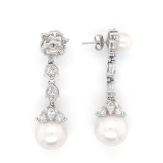 Hanging pearl dangle earrings with round / marquise combination cut natural white diamonds 5.09 ct in total. Diamonds are in G-H Color Clarity VS. Pearls are freshwater and round ( top is 7.5 mm and bottom is 13.8 mm ). Classic back stud. Length: 4.5 cm Width: 1.3 cm Weight: 18.8 g Diamond White Pearl Drop Bridal Earrings, Diamond White Bridal Earrings With Pearl Drop, Luxury Diamond Dangle Pearl Earrings, Diamond Pearl Dangle Earrings With Elegant Design, White Gold Pearl Earrings With Diamond Dangle, Akoya Pearl Drop Diamond Earrings For Wedding, Wedding Akoya Pearl Drop Diamond Earrings, Wedding Diamond Earrings With Pearl Drop, Luxury Diamond White Dangle Pearl Earrings