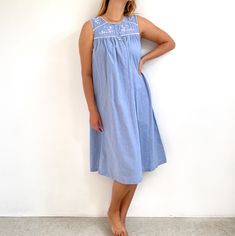 Sweet, cute, summery vintage cotton nightie in light blue cotton with white floral embroidered bib. It has a relaxed A-line shape with a round collar and three front buttons. It is made from soft, light, mid-weight cotton perfect for summer nights. Beautiful girly nightgown - perfect for sleeping, but also, could perfectly well be worn outside, cinched in with a pretty belt. Made in India by Gilligan & O'Malley. 100% cotton. Medium size. Measurements when laid flat are: Pit to pit: 49cm  Waist: Cotton Relaxed Fit Nightgown For Spring, Spring Cotton Bedtime Dress, Casual Cotton Nightgown For Summer, Spring Cotton Nightgown With Lace Trim, Spring Cotton Sleepwear With Floral Embroidery, Summer Cotton Sleepwear With Floral Embroidery, Cotton Sleepwear With Floral Embroidery For Spring, Casual Cotton Nightgown With Lace Trim, Casual Blue Nightgown For Spring