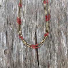 Combination of corals and brass beads strung on a three strands necklace Approximately 36 inches long Gold Double Strand Hand-strung Necklace, Gold Double Strand Hand-strung Beaded Necklaces, Traditional Multi-strand Red Coral Necklaces, Handmade Multi-strand Red Coral Necklace, Traditional Multi-strand Red Coral Necklace, Multi-strand Red Coral Beaded Necklaces, Coral Multi-strand Beaded Necklaces, Gold Multi-strand Hand-strung Necklace, Coral Multi-strand Beaded Necklace