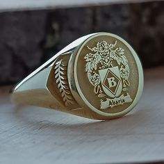 Luxury Engraved Ring With Coat Of Arms For Gift, Classic Customized Round Jewelry, Customized Classic Round Jewelry, Symbolic Engraved Ring With Engraving Option As Gift, Customized Gold Engraved Ring As Gift, Customized Gold Engraved Ring For Gift, Customized Yellow Gold Rings For Gift, Adjustable Hallmarked Signet Ring As Gift, Vintage Engraved Ring, Customizable For Gift