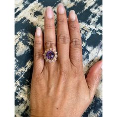 Amethyst, Pink Sapphire, and Diamond Cocktail Ring!  Playful yet Powerful! Its like having a piece of glittery candy on your finger! This ring has a Checkers Round Cut Amethyst that weighs 4.90 Carats and is embellished with alternating 12 Pink Sapphires that weigh 0.28 Carats and 12 Round Cut Diamonds that weigh 0.20 Carats. (Clarity: SI2, Color:F) The total carat weight of the ring is 5.38 Carats.  The ring is crafted in 14 Karat Yellow Gold and weighs approximately 4.8 grams. The ring is a si Heirloom Amethyst Ring With Center Stone, Heirloom Amethyst Rings With Gemstone Accents, Amethyst Cluster Gemstone Jewelry, Purple Topaz Ring In Prong Setting, Purple Topaz Ring With Prong Setting, Dazzling Diamond Ring With Gemstone Accents For Gift, Fine Jewelry Purple Topaz Ring With Prong Setting, Dazzling Diamond Ring With Gemstone Accents As A Gift, Purple Diamond Gemstones With Accent Stones