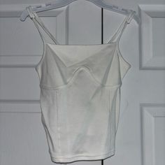 White Never-Been-Worn Tank Top, Nwt, Extra Small White Fitted Top With Tank Straps, Fitted White Top With Tank Straps, White Fitted Tank Top, White Stretch Cami Crop Top, White Sleeveless Camisole With Built-in Bra, Fitted White Tank Top With Built-in Bra, White Fitted Sleeveless Tank Top, White Fitted Sleeveless Crop Top, White Crop Top Tank With Adjustable Straps