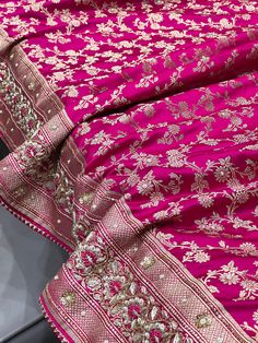 Shimmer and shine with this Banarasi Rani Saree. The intricate Zardosi and Resham embroidery adds a touch of elegance, while the handmade details make it truly special. Perfect for any occasion, this saree will surely make you stand out. Luxury Zari Work Embroidered Saree Dress, Luxury Banarasi Silk Traditional Wear With Resham Embroidery, Luxury Resham Embroidery Saree Set, Luxury Traditional Wear With Resham Embroidery In Banarasi Silk, Luxury Banarasi Silk Unstitched Suit With Embroidery, Luxury Resham Embroidery Jamawar Dupatta, Luxury Saree Set With Resham Embroidery, Luxury Embroidered Saree For Puja, Luxury Gota Work Saree For Festivals