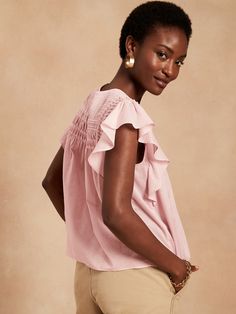 Soft with delicate pintucks, our lightweight ruffle-sleeve top is semi-sheer and made from 100% cotton for luxurious summer-day charm.  SWING FIT: Cut for a flowing, A-line fit.  No waist definition.  Crew neck with button-keyhole at back.  Straight Summer Ruffle Sleeve Blouse, Summer Feminine Blouse With Ruffle Sleeves, Feminine Summer Blouse With Ruffle Sleeves, Chic Summer Blouse With Ruffle Sleeves, Chic Summer Tops With Flutter Sleeves, Elegant Airy Blouse For Summer, Spring Flutter Sleeve Blouse, Feminine Top With Smocked Back And Flutter Sleeves, Summer Feminine Blouse With Flutter Sleeves