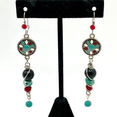 Hand Crafted Wire Wrapped Glass Bead And Metal Drop Dangle Pierced Earrings. Southwestern Style Metal Disc Enameled In Turquoise, White And Deep Red Holds A Dangle Wire Wrapped Bead Drop Of Three Graduated Size Beads -- A Black, Turquoise Crystal And Deep Red Crystal Followed By Another Small Dangle Of Turquoise Crystal. These Have A Drop Of About 3 1/4". Lightweight. New Never Worn. Stainless Steel Ear Wires. One Of A Kind. Unique. Please Ask If You Have Questions. Bohemian Round Beaded Earrings With Silver Beads, Adjustable Multicolor Earrings With Silver Beads, Silver Southwestern Beaded Earrings With Ear Wire, Southwestern Silver Beaded Earrings With Ear Wire, Southwestern Red Beaded Earrings With Dangling Beads, Southwestern Red Earrings With Dangling Beads, Southwestern Red Beaded Dangling Earrings, Southwestern Style Red Earrings With Dangling Beads, Red Southwestern Style Earrings For Festivals