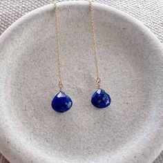 Our dainty lapis lazuli thread earrings are the perfect lightweight everyday earring. As simple as they are, the dangling sparkling semi precious lapis gemstone really makes a statement. We offer a choice of every month's birthstone as well as other popular gemstones in the drop-down menu. We also offer these earrings in gold filled, sterling silver, rose gold and 14k gold. If you need your order by a certain date, it is very important to send us a message on Etsy directly after you place your order, as well as write it in the 'Notes to Seller' at checkout.  For more information, please refer to our FAQ page. Jewelry is handmade by us in NYC focusing on quality using only the highest quality materials and handpicked genuine gemstones.   ▹ PACKAGING All jewelry is beautifully wrapped in tis Blue Adjustable Long Drop Jewelry, Dainty Blue Drop Earrings, Blue Minimalist Dangle Jewelry, Blue Dangle Jewelry With Adjustable Chain, Blue Linear Earrings With Ear Wire For Gift, Dainty Blue Drop Jewelry, Blue Long Drop Teardrop Earrings For Pierced Ears, Blue Long Drop Teardrop Earrings, Minimalist Blue Teardrop Jewelry