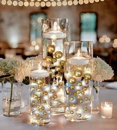 Transform ordinary vases into EXTRAordinay Floating Gold Pearls Centerpieces and wow your guests with these fascinating vase decorations and vase fillers. Perfect for wedding centerpieces, anniversaries, bridal showers, birthdays, baby showers, graduations, Christmas, gifts, and more… Each Pack fills 1 gallon of 75 Floating Gold Pearls with The Transparent Floating Gels for your vases. No holes and shiny in sizes: 6 (1.10”/28mm), 14 (0.75”/20mm), 55, (0.5”/14mm). Including Floating Gels Kit cont Bridal Shower Centerpieces Flowers Simple, Wedding Farm Table Candles, Holiday Floating Candle With Water Beads, Winter Wonderland Centerpieces Zazzle, Water Candles Floating Christmas, Orbeez Floating Candles Christmas Kits, Succulent Floating Candles, Winter Bridal Shower Table Centerpieces, Table Centerpiece For Wedding Shower