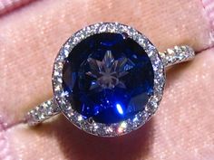 Moissanite Halo Engagement Ring With Jubilee Cut Lab Blue | Etsy Luxury Halo-set Lab-created Sapphire Jewelry, Luxury Jewelry With Halo Setting And Lab-created Sapphire, Formal Tanzanite Halo Ring, Timeless Sapphire Jewelry With Halo Setting, Sapphire Halo Ring With Vvs Clarity, Dazzling Sapphire Ring With Halo Setting, Luxury Sapphire Jewelry With Halo Setting, Moissanite Halo Ring With Gemstone, Tanzanite Jewelry With Halo Design And Round Cut