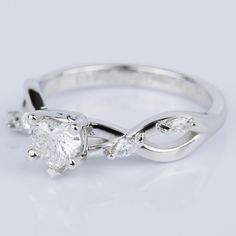 a white gold engagement ring with three stones