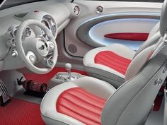 the interior of a car with red and white seats