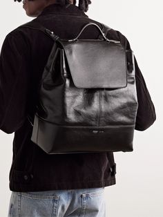 Métier's 'Glide' backpack is such a sleek way to carry the essentials, whether you're headed to the office or airport. Handcrafted in Italy from panels of glossy full-grain leather, it's stamped with the label's logo and can be carried by the sturdy top handle or adjustable shoulder straps. It has a laptop sleeve along with plenty of pockets to keep your keys, phone and wallet organised. Leather Backpack For Men, Summer Sunglasses, Wallet Organization, Mr Porter, Short Suit, Loungewear Shorts, Lightweight Jacket, Full Grain Leather, Laptop Sleeves