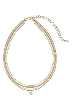 Instantly create a trend-right layered effect with this gold-plated multistrand necklace accented with a single sparkling stone. 16" longest strand length; 14" shortest strand length:5" extender 1/4" pendant diameter Lobster clasp closure 18k-gold plate/cubic zirconia Imported