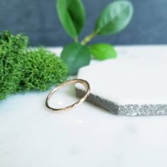 Hammered Simple Slim 14K Rose Gold Filled wire is formed into the perfect little gold stacking ring.   1mm thick, looks fabulous on it's own or stack them up high, interspersed with sterling silver rings. You can find all my stacking rings here: http://www.etsy.com/shop/Decadence2Jewelry?section_id=11172168  Looks awesome with all my stacking rings, gold filled and sterling silver (see last photo).  This is a listing for a single stacking ring in 14K Rose Gold Filled wire. I can also do this rin Delicate Stackable 14k Rose Gold Rings, Minimalist Hammered Stackable Rings In Recycled Gold, Stackable Rose Gold Hoop Jewelry, Rose Gold Stackable Hoop Jewelry, Delicate Hammered Yellow Gold Ring, Delicate 14k Rose Gold Stackable Rings, Dainty Hammered 14k Gold Rings, Dainty Rose Gold Stackable Rings Tarnish Resistant, Dainty 14k Gold Hammered Rings