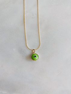 "It's all in the lil details💚 Gorgeous vibrant green evil eye on our gold plated gold snake chain. Such a fun piece to layer with⚡️ Length: 14-17\" adjustable" Everyday Green Round Pendant Charm Necklaces, Everyday Green Round Pendant Charm Necklace, Green Charm Necklace With Adjustable Round Pendant, Green Charm Necklace With Round Pendant And Adjustable Chain, Adjustable Necklace With May Birthstone, Trendy Green Jewelry With Adjustable Length, Green Gold Plated Necklace With Adjustable Chain, Trendy Adjustable Evil Eye Necklace, Trendy Adjustable Evil Eye Necklaces