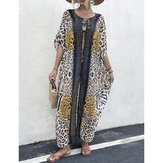 This Long Beach Cover Up Leopard Print For Women is a must-have for your summer vacation. Made from soft and lightweight chiffon/rayon fabric with a delicate print pattern all over, it is the perfect way to add a touch of style to your swimwear or summer clothing. The trendy kimono style is suitable for wearing relaxed and over your swimsuit, or as a flattering coat dress paired with casual summer clothing. This one-size cover-up fits S, M, L, and XL and features a 51.2" length, 61.4" bust, and Printed Beach Dress For Spring Cover-up, Chiffon Cover-up For Vacation, Bohemian Rayon Cover-up For Vacation, Chiffon Beach Season Cover-up For Vacation, Bohemian Chiffon Cover-up For Vacation, Summer Chiffon Cover-up, Beachy Boho Print Cover-up For Vacation, Vacation Rayon Cover-up, Summer Chiffon Cover-up For Beach Season