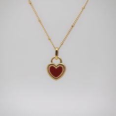 Black or red, red or black. This gold necklace features a two-faced heart pendant: black heart or red heart. Wear a different color when you have different mood. This necklace evokes us to pay attention to our emotions and self-care. Red Heart Necklace, Two Faced, Expensive Jewelry Luxury, Red Or Black, Chunky Jewelry, Jewelry Lookbook, Dream Jewelry, Black Heart, Gold Jewelry Fashion