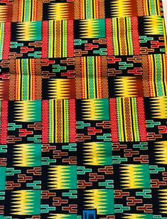 an african print fabric with different colors and patterns