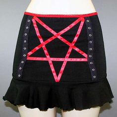 DETAILS Custom-made pentagram mini skirt created using red satin ribbon with black grommet tape on the front and a red elastic waist band. LENGTH: 13" (fits at hip) MODEL: Mannequin has 37" hip VIEW SIZE GUIDE CARE: Hand wash cold, hang dry. SHIPPING: Made When Ordered Please allow 1-2 WEEKS to ship. Emo Wardrobe, Goth Ideas, Scene Clothes, Custom Skirt, Goth Things, Model Mannequin, Fnaf Cosplay, Outfit Pieces, Skirt Diy