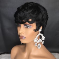 Hair Material: Crafted from 100% high-quality human hair, our short black wig offers a soft and full texture with no shedding or tangling. This versatile wig can be permed, curled, or straightened to suit your desired style. Hair Length: With a length of 4-5 inches, our short black wig complements a variety of face shapes and styles. The short glueless design ensures easy wear and maintenance, perfect for black women seeking a chic and effortless look. Cap Size: Designed to fit most head sizes, our wig features a one-size cap (22-23.5 inches) with adjustable straps inside. This allows for a customized fit, ensuring comfort and security throughout the day. Wig Features: Our short pixie cut wig for black women boasts a stylish and modern look, enhancing your natural beauty with ease. Whether Short Black Wig, Natural Hair Short, Short Black Wigs, Natural Wigs, 100 Human Hair Wigs, Pixie Cut Wig, Short Black Hairstyles, Black Wig, Short Pixie Cut