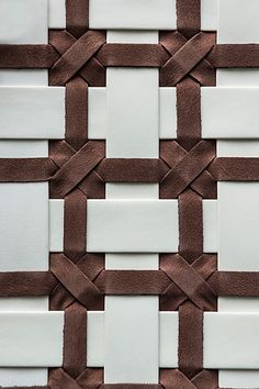 the wall is made up of white and brown squares