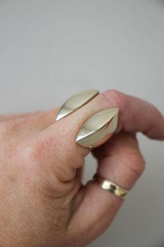 My clam ring is available in sterling silver or solid brass, this is the brass listing.  Also available in luxury solid 9ct yellow gold upon request. This ring is a firm favourite - my most loved and eye catching piece! The idea for this design was born out of my love for chunky, solid, heavy rings - yet with careful consideration for ultimate comfort & wearability! -d e t a i l s- Somewhat resembling an open clam, the two symmetrical sides come together to hug the finger in an open-ended style. Unique Gold Sterling Silver Dome Ring, Unique Wide Band Open Ring With Polished Finish, Silver Brass Open Signet Ring, Unique Gold-colored Sterling Silver Midi Rings, Heavy Rings, Gold Cuff Ring, Cuff Ring, Gold Statement Ring, Cuff Rings