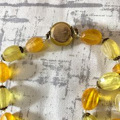 Vintage 1950s beaded necklace signed MADE AUSTRIA Box closure Please see photos for measurements Good condition Unique and fun piece! -: ✧ :- More Vintage Jewelry: https://www.etsy.com/shop/ElectricEyeThrift?section_id=26028118 ✶ VINTAGE ✶ Please note that this item is vintage. Wear and tear representative of its age may be present. Anything major will be in the description, but please look closely at the photos. Feel free to send me a message or request additional photos. Thank you! Handmade Vintage Yellow Beaded Necklaces, Vintage Orange Necklace With Faceted Beads, Vintage Polished Yellow Beads Jewelry, Vintage Orange Hand-strung Beaded Necklaces, Vintage Hand-strung Orange Beaded Necklace, Book Locket, Orange Poppy, Puffed Heart, Long Chain Necklace