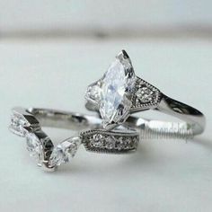 three engagement rings with diamonds on them