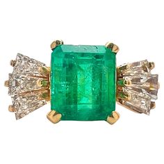 14K yellow gold ring with emerald and diamond. Sophia D has been known world-wide for over 40 years because of its rich history of design and quality craftsmanship. From art deco to antique reproduction, these timeless pieces, when merged with modern manufacturing techniques, create a perfect harmony between old and new. Vintage Green Emerald Ring Gia Certified, Gia Certified Green Diamond Ring In Vintage Style, Art Deco Yellow Gold Emerald Ring With Brilliant Cut, Vintage Gia Certified Gold Emerald Ring, Art Deco Emerald Ring With Diamond Accents, Heirloom Green Diamond Ring With Baguette Cut, Heirloom Green Diamond Ring Baguette Cut, Heirloom Green Baguette-cut Diamond Ring, Heirloom Green Baguette Cut Diamond Ring