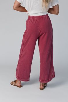 Comfy and cozy all in one! Our lounge pant features a wide leg, drawstring waist and pockets (yay!). It will be your closet fave to pair with graphic tees for lounging or on-the-go outfits! *Due to lighting and differences in monitors, actual colors may vary slightly from what appears online. Model is 5'8" and wearing size Small Approximate measurements are as follows: SMALL: Waist: 26", Inseam: 26 1/2", Length: 34" MEDIUM: Waist: 28", Inseam: 27", Length: 34 1/2" LARGE: Waist: 30", Inseam: 27 1 Casual Loungewear Bottoms With Drawstring, Leisure Cotton Pants With Pull-on Style, Casual Full Length Joggers With Drawstring, Casual Full-length Joggers With Drawstring, Casual Full-length Drawstring Joggers, Comfy Stretch Bottoms With Drawstring, Casual Full Length Yoga Pants With Comfort Waistband, Comfy Wide Leg Relaxed Fit Joggers, Casual Loungewear Bottoms With Pockets