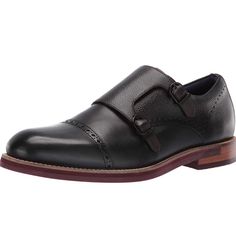 Classic Double Buckle Monk Shoe In Softly Burnished Leather With Zig Zag Counter Stitch Detail And Lightly Tumbled Leather Panels. Contemporary Layered Sole Featuring Ted Baker Geometric Tred. Moulded Footbed Printed With Seasonal Artwork. Padded Topline And Tongue Adding To All Day Comfort. Black Slip-on Monk Strap Shoes With Plain Toe, Black Slip-on Monk Strap Shoes For Business, Black Monk Strap Slip-on Shoes For Business Casual, Black Wingtip Monk Strap Shoes With Branded Insole, Black Leather Monk Strap Shoes, Black Slip-on Monk Strap Shoes For Semi-formal Occasions, Black Leather Lined Monk Strap Shoes For Business Casual, Black Wingtip Monk Strap Shoes With Leather Lining, Black Leather Lined Wingtip Monk Strap Shoes