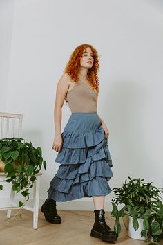 Ready to ship. Eco Denim Our beautiful palace midi skirt features ruffles that cascade down creating a very romantic, yet slimming fit. Beautifully made, with the perfect fit at the waist. Eco denim is dyed with eco friendly practices in India. Hand wash or eco wash recommended. As this denim has not been treated with a sealer we recommend that you pre-wash it at home, we did this to protect the environment. All of our collection garments have been produced ethically with eco consciousness in mi Spring Denim Blue Asymmetrical Skirt, Cotton Tiered Denim Skirt With Ruffles, Ruffled Medium Wash Skirt For Spring, Medium Wash Ruffled Skirt For Spring, Denim Blue Ruffled Skirt For Spring, Denim Blue Tiered Skirt For Spring, Denim Blue Ruffled Cotton Skirt, Spring Tiered Ruffle Denim Skirt, Spring Medium Wash Tiered Skirt