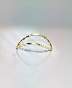 Very unique elegant curved thumb ring a perfect ring to add to your collection of jewelry. Sturdy and well designed for any occasion Very pretty on any finger!! Full round ring: 1.0mm thick ** Don't know your finger size? Print this: http://www.licketycut.com/printableringsizer.pdf SALE!! Great Value! **Dainty Rings On SALE Now** **100% Quality Guaranteed** --Thank you for stopping by. Please visit our new Etsy shop and view our other very unique Beautiful pieces of jewelry. --PLEASE FOLLOW -- - Minimalist Curved Gold Jewelry, Modern Gold Rings With Curved Design, Modern Gold Curved Rings, Modern Curved Gold Rings, Minimalist Curved Yellow Gold Ring, Gold Curved Rings For Gifts, Curved Gold Rings For Gifts, Gold Curved Rings For Gift, Curved Yellow Gold Jewelry Gift