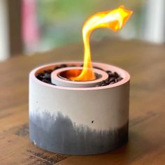 a close up of a burning object on a table