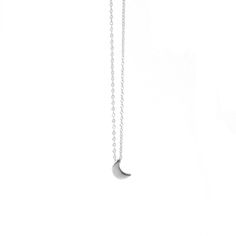 Half moon-shaped charm necklace. This delicate necklace is perfect for wearing alone or for layering with other necklaces. Everyday necklace perfect for any occasion. Details: * Crafted in Gold vermeil plated .925 sterling silver * Also available in 925 silver * Necklace measures 18inch in total. * Comes with an extension chain and can be worn at 16inch or 18inch. * Nickel free Moon charm measures: 10x6mm All jewelry comes in beautiful packaging, gift ready. Made with love Feel free to contact m Everyday Crescent Necklace With Delicate Chain, Minimalist Crescent Charm Necklace With Clavicle Chain, Minimalist Crescent Clavicle Chain Charm Necklace, Silver Chain Necklace With Moon Charm As Gift, Minimalist Half Moon Phase Necklace, Minimalist Crescent Necklaces For Everyday, Everyday Half Moon Charm Necklace, Everyday Minimalist Crescent Necklaces, Minimalist Moon Phase Pendant Necklace