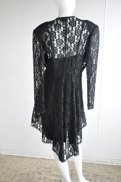 "A gorgeous 2-piece dress and jacket featuring sequins, beads, and lace. The jacket has a hidden eye and hook closure. There are two front panels that end in beads. Has shoulder pads. Brand is Dollar. Vintage size 17. Seems suited for a modern-day large, but please see below for accurate fit. CONDITION: Wonderful. No flaws to note. MEASUREMENTS JACKET Bust: 44\" Waist: 34\" Length: 46\" Shoulder span: 18\" Sleeve: 25\" DRESS Bust: 38\" Waist: 34\" Hips: 40\" Length: approx. 38\" Have a question? Gothic Lace Party Dress, Party Lace Dress With Long Sleeves And Lace Collar, Long Sleeve Lace Dress With Lace Collar For Party, Fitted Lace Dress For Evening In Fall, Gothic Lace Dress For Party, Gothic Lace Dresses For Fall, Fall Party Lace Dress With Patchwork, Fall Party Lace Dress, Fall Wedding Lace Dress Fitted