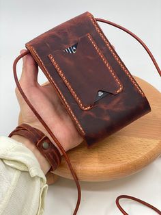 18x10 cm , Competitable with all mobile phones smaller than 16x9 cm . Genuine Leather Handmade Unisex Phone Bag. Very attractive look and practical use. 2 inner pocket and 1 special cardholder place. Your Special Belongings are safe at anytime. With round shape leather strap you never feel anything on your shoulder. Easy to carry cross hanger style and its too light . If you bored with big heavy bags , then you're lucky because our phone bag will adapt easily in your daily life and become your e Rectangular Shoulder Bag With Card Slots For Daily Use, Rectangular Wallet With Mobile Phone Bag, Phone Bag Leather Handmade, Rectangular Phone Bag With Card Slots, Leather Shoulder Bag With Card Slots For Personal Use, Travel Phone Shoulder Bag With Card Slots, Gift Shoulder Bag With Rectangular Mobile Phone Case, Rectangular Phone Bag With Interior Card Slots For Gift, Rectangular Mobile Phone Bag For Daily Use