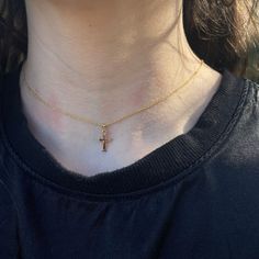 A baby-size polished 14K yellow gold-filled engraved cross pendant on a cable chain necklace with a lobster clasp. Cross pendant: 17 x 8 mm Chain length: 13" Small Cross Necklace, Engraved Cross, Cable Chain Necklace, Cross Pendant Necklace, Baby Size, Cable Chain, Chain Lengths, Cross Pendant, Chain Length