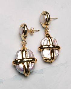 These gilded Pearl Gift Box Earrings will add a touch of sophistication to any outfit. The dangle design is sure to catch attention, while the luxurious pearls add a classic elegance. Perfect for gifting or treating yourself. 18k gold-plated, freshwater pearl, sterling silver post Lightweight | hypoallergenic | 0.8" drop Handmade in Los Angeles with imported materials Follow these tips to keep your jewelry looking its best! Gold Plated Metal Pearl Earrings, Classic Gold Metal Pearl Earrings, Formal Gold Jewelry With Pearl Drop, Formal Gold Pearl Drop Jewelry, Metal Earrings With Pearl Chain For Gift, Metal Earrings With Pearl Chain As Gift, Metal Pearl Chain Earrings As Gift, Gold-plated Dangle Pearl Earrings, Gold-plated Gold Pearl Dangle Earrings